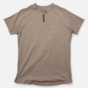 Alphalete performance fit short sleeve tee tan S curved hem